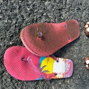 Worn down pink flip flops